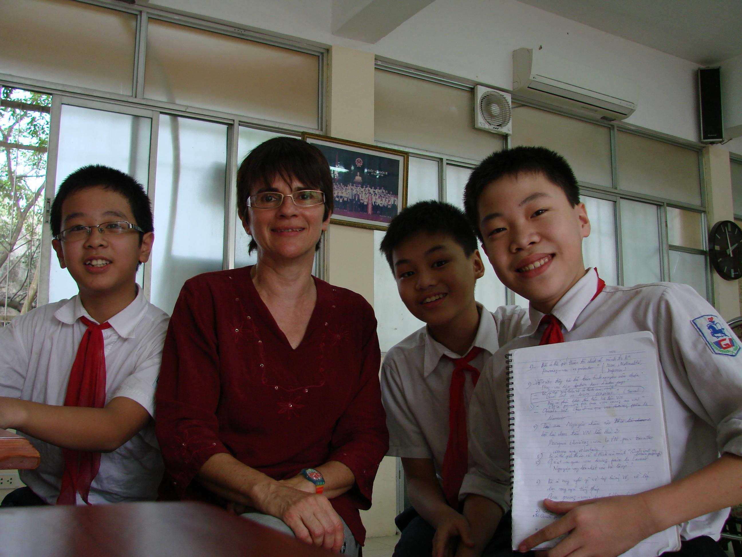 Students and a volunteer at the volunteer teaching placements in Vietnam Young students take a photo with the Projects Abroad volunteer gaining teaching work experience in Vietnam